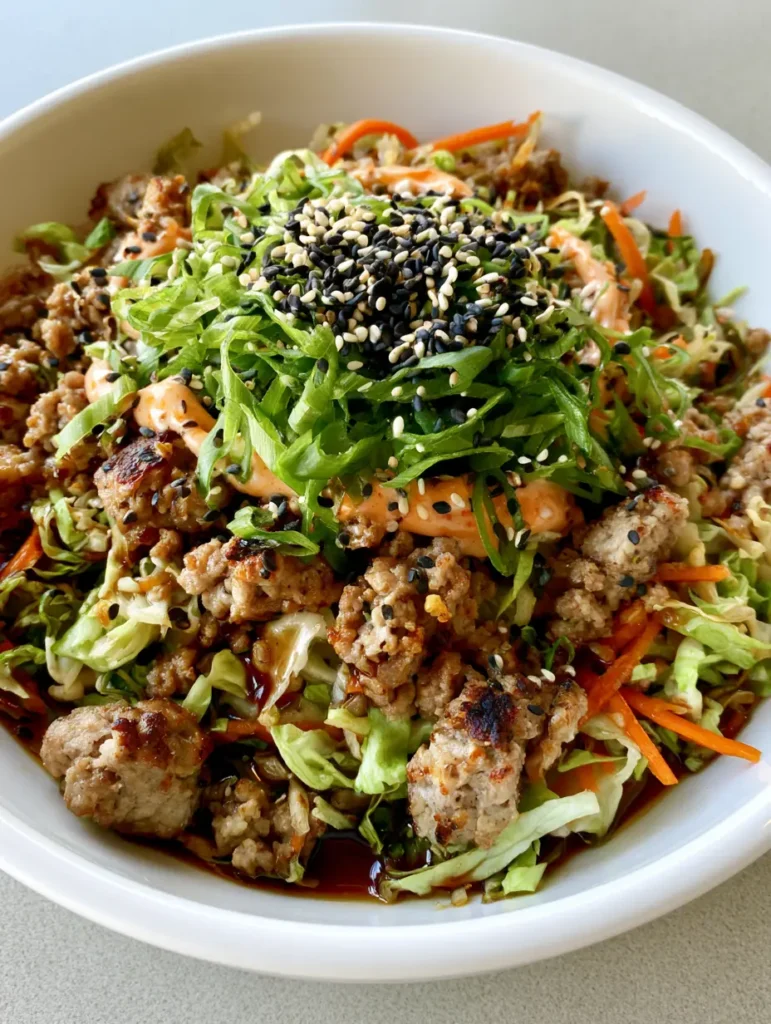 Egg Roll in a Bowl: The Ultimate 15-Minute Crack Slaw Recipe 1 Detailed shot of seared meat crumbles and bright cabbage in an Egg Roll in a Bowl.